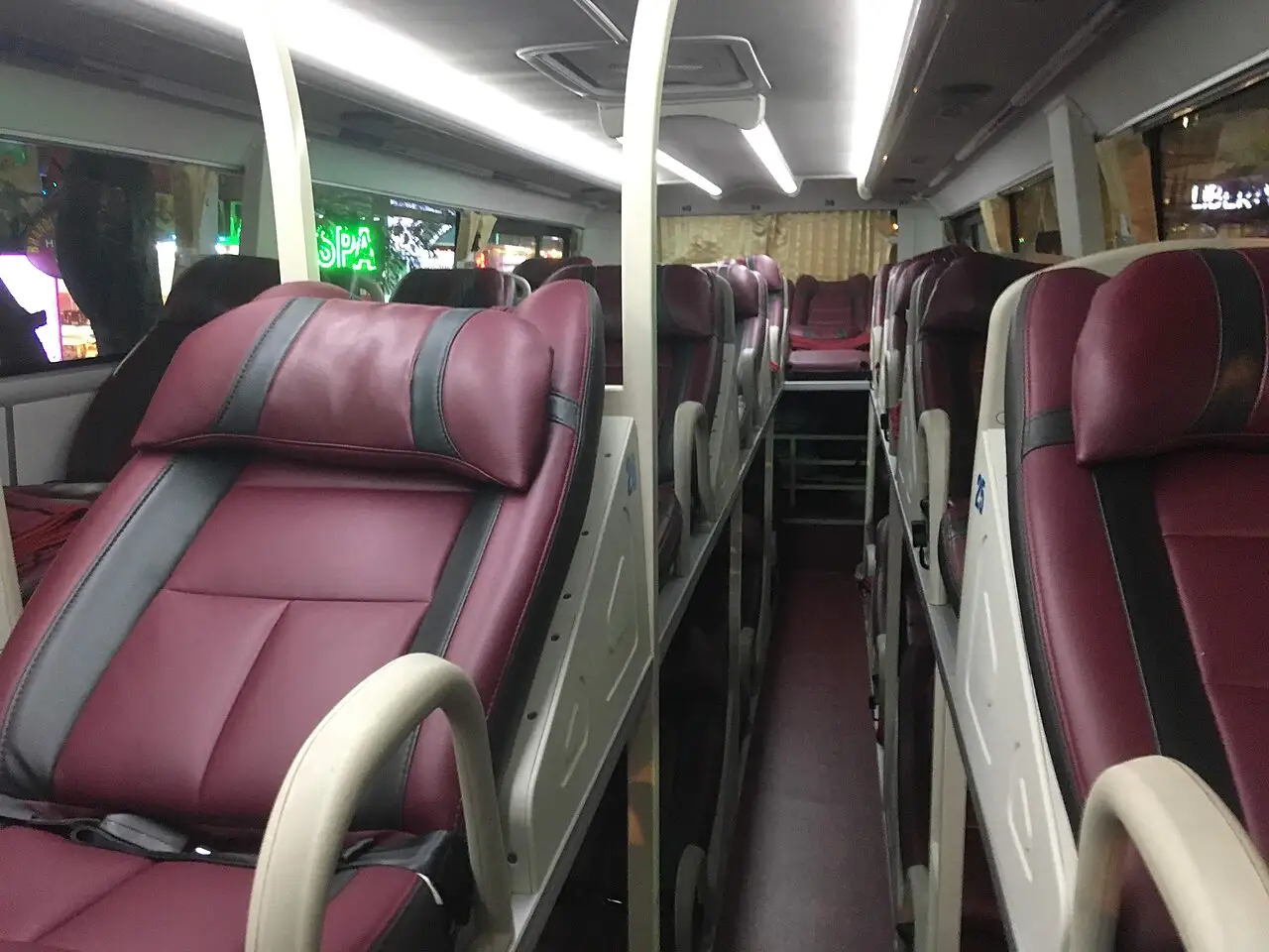 Two levels of reclining leather berths inside a night bus from Nha Trang to Hoi An, Vietnam